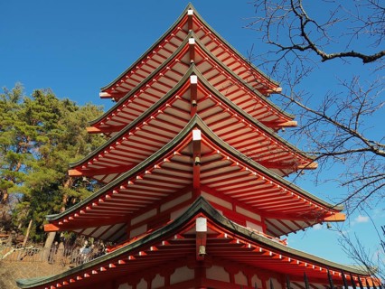 Close-up view of a multi-storey pagoda with blue sky in the background, Chureito Pagoda,