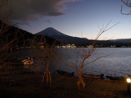 View of lake at night with Mount Fuji in the background and calm atmosphere, Lake Kawaguchiko,