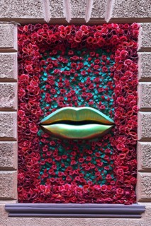 Window with rose petals and gold-colored mouth, Casanova restaurant, Lviv, Ukraine