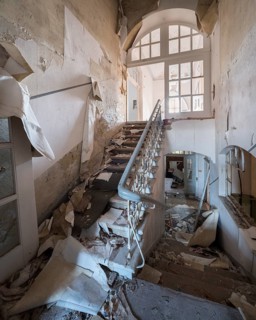 Staircase of an abandoned administration building full of rubble and trash, Lost Place,