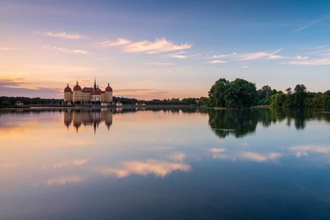 Moritzburg Castle, Augusts the Strong hunting lodge at dawn, water reflection in the lake, Saxony,