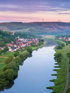 View from the Weser Skywalk towards Herstelle and Würgassen at dawn at dusk, Beverungen, Höxter,