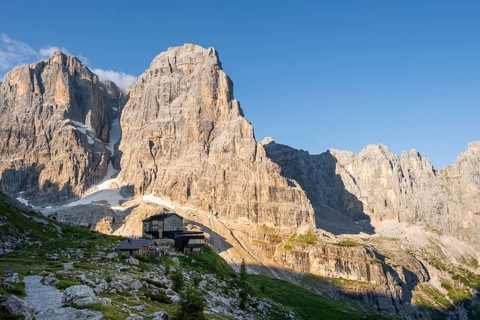 Sunrise, Rifugio Maria e Alberto ai Brentei, Crozzon di Brenta and Cima Tosa peaks in the back,