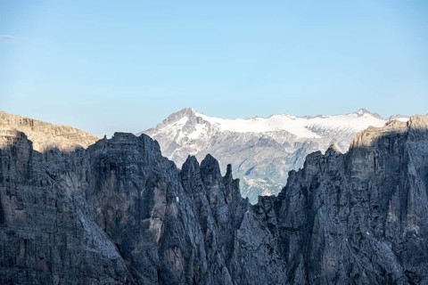 Adamello mountain peak with glacier, in front Brenta Mountains, Brenta-Adamello Natural Park,