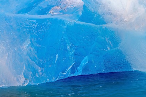 Blue ice wall of Idabreen, Ida glacier calving into Liefdefjorden at Idabukta bay, Haakon VII Land,