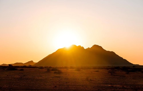 Spitzkoppe silhouette at sunset, orange sky, Spitzkoppe, Namibia