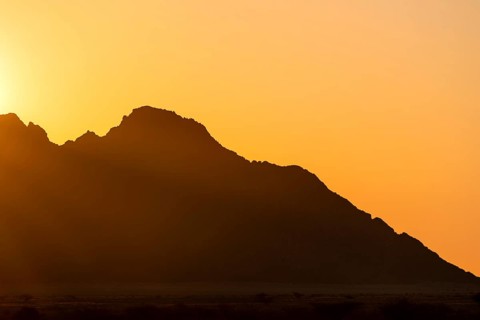 Rugged mountain silhouette at dusk, Spitzkoppe, Namibia