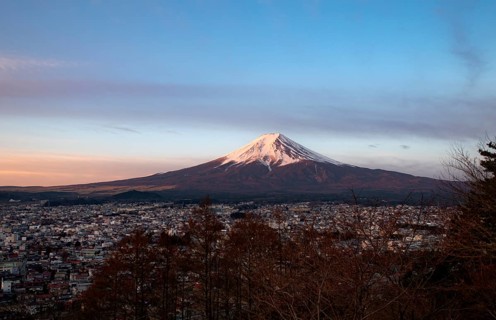 View of Mount Fuji volcano over Fujiyoshida City, at sunrise, Arakurayama Sengen Park, Yamanashi