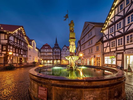 Market square with Roland fountain, cobblestones and half-timbered houses in the historic old town
