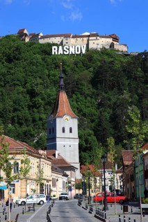 Town of Rasnov, German Rosenau. In the foreground is the distinctive clock tower of the Protestant