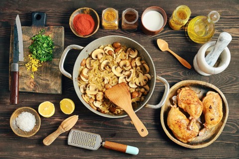 Chopped mushrooms and onion frying in a pan. Process of preparation of creamy mustard sauce for