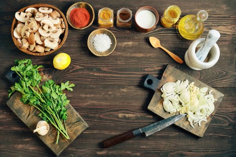 Flat lay of chopped culinary ingredient ready for cooking. High angle view of vegetables, spice,