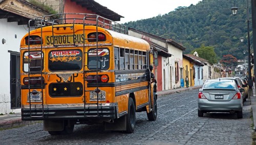 Colorful bus in the old town, former American school bus, Antigua, Sacatepéquez Department,