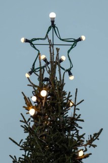 Christmas tree illuminated with light bulbs with star tip, Korpoström, Korpo or Korppo,