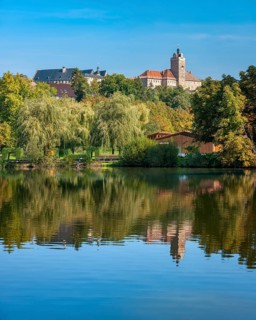 Allstedt Castle and Palace reflected in the lake, site of the Reformation, Saxony-Anhalt, Germany