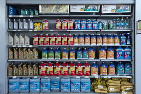 Sales rack with motor oil at a gas station, Bulgaria