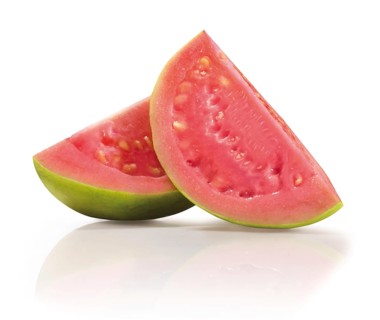 Two quarters of a sliced guava (Psidium guajava) in front of a white background, studio photo