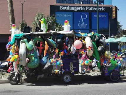 Colourful sales stand full of toys and balloons in an urban setting, Marrakech, Morocco
