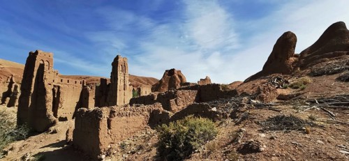 Ancient ruins of a past civilization under bright blue skies in desert-like surroundings, Morocco