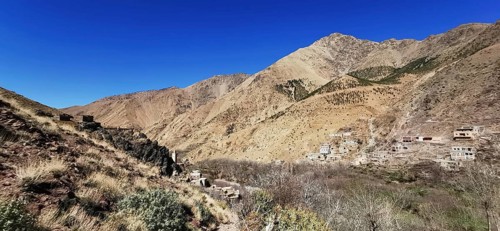 Panorama of a rural settlement in a barren mountain landscape, Atlas Mountains, Morocco