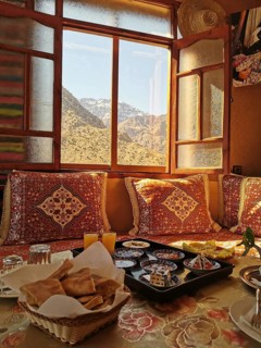 Traditional room with mountain views and breakfast in the warm light of the morning, Atlas