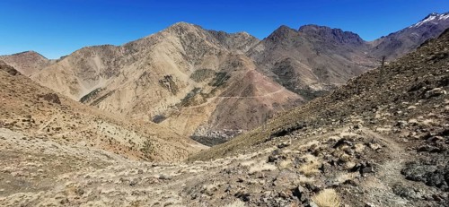 Panorama of a dry, rocky mountain landscape under clear sky, Atlas Mountains, Morocco