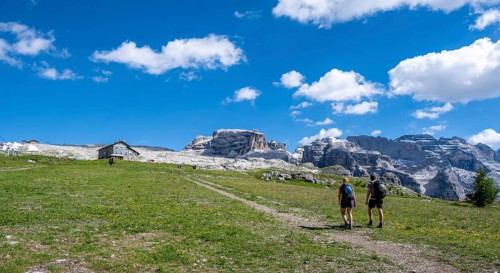 Hikers in front of Rifugio Graffer, Brenta, Brenta-Adamello Natural Park, Trentino, Italy