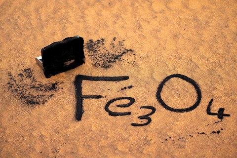 Iron oxide, Fe3O4 collected from sand with magnets, Namib desert near Walvis Bay, Namibia
