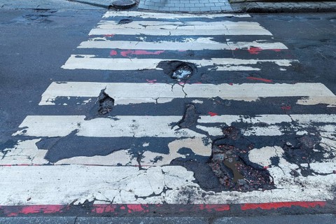 Dilapidated street and crosswalk, Lviv, Ukraine