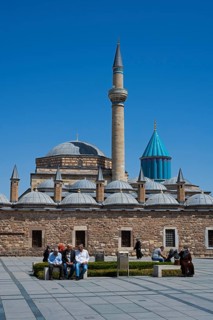 Historic mosque with impressive minaret and domes under a clear blue sky, Mevlana Museum, Mevlana,