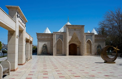 Historic building with Islamic architecture under blue sky, Istiklal Harbi Sehitleri Abidesi,
