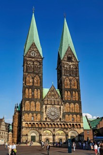 Gothic cathedral with two towers and clock under a clear sky, The Cathedral of Bremen