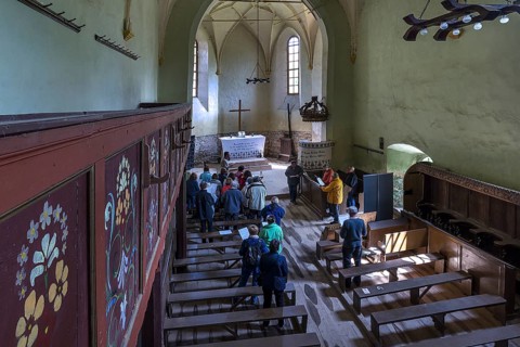Improvised service in the abandoned church in Tobsdorf, Transylvania, Bulgaria