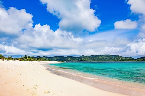 White clouds Cumulus clouds over Caribbean uninhabited Caribbean island from Lesser Antilles in