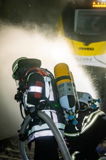 Firefighters work in a tunnel on a train operation, fire brigade exercise on the Hermann Hesse