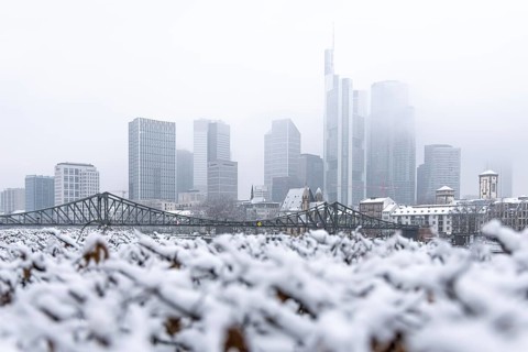 Clouds envelop Frankfurt's banking skyline. Heavy snowfalls have caused another onset of winter in