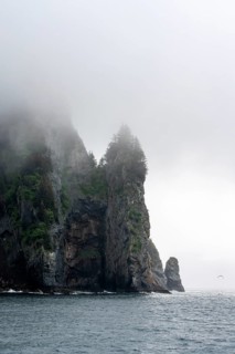 Mystical fog sweeps around rocky islands on the coast, Kenai Fjords National Park, Kenai Peninsula,