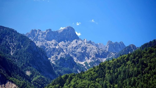 Mountain massif with rocky peaks and forest, Slovenia