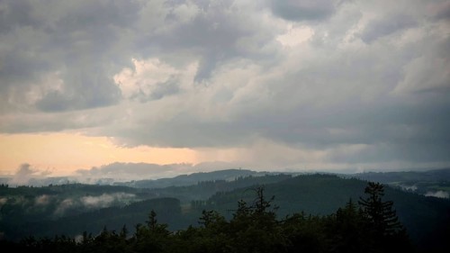 Dense clouds cover the mountain landscape and create an oppressive atmosphere, Fichtelgebirge