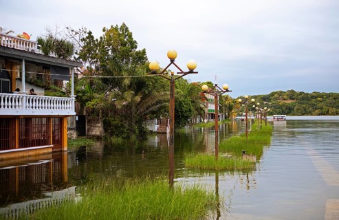 Flooded shore on Lake Petén Itzá in Flores, Petén Department, Guatemala