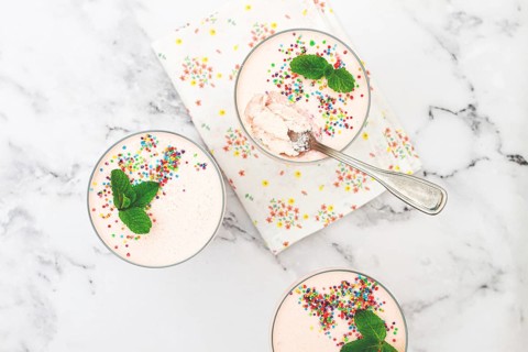Fruit mousse, made from jelly and cottage cheese, in glasses, decorated with sprinkles and mint,