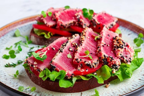 Sandwiches with fried tuna fillet in sesame seeds, breakfast, top view, homemade