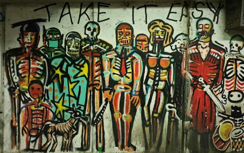 Colourful skeleton-style graffiti artwork with the inscription 'Take It Easy, 'Tbilisi, Georgia