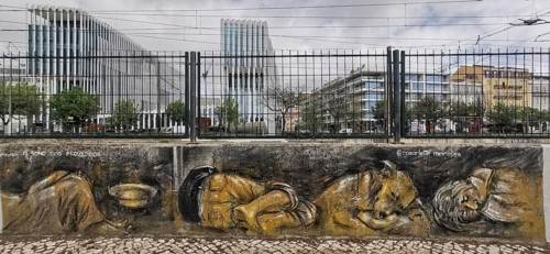 Street art depicts homeless people against a modern urban backdrop, Lisbon, Portugal