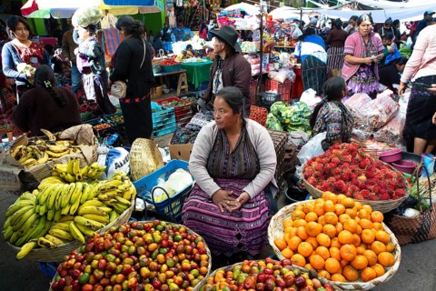 Mayan woman wearing traditional clothes at the market in Sololá, Highlands, Sololá Department,