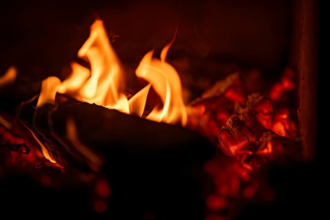 Burning wood, log, embers, fire in a fireplace