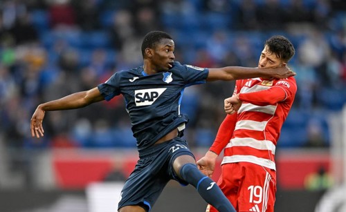 Foul, punch in the face, head-to-head duel action Bazoumana Toure TSG 1899 Hoffenheim (29) v Janik