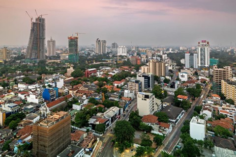 Urban scene at dusk with high-rise buildings and quiet surroundings, The skyline of Colombo in Sri