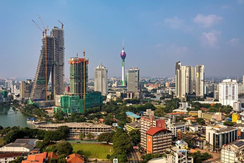 Architectural skyline with television tower and skyscrapers under a blue sky, the skyline of