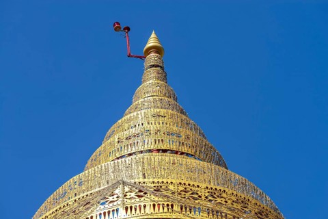 Umbrella over the Buddha statue in Wat Intharawihan, a ceremonial, often multi-level symbol of